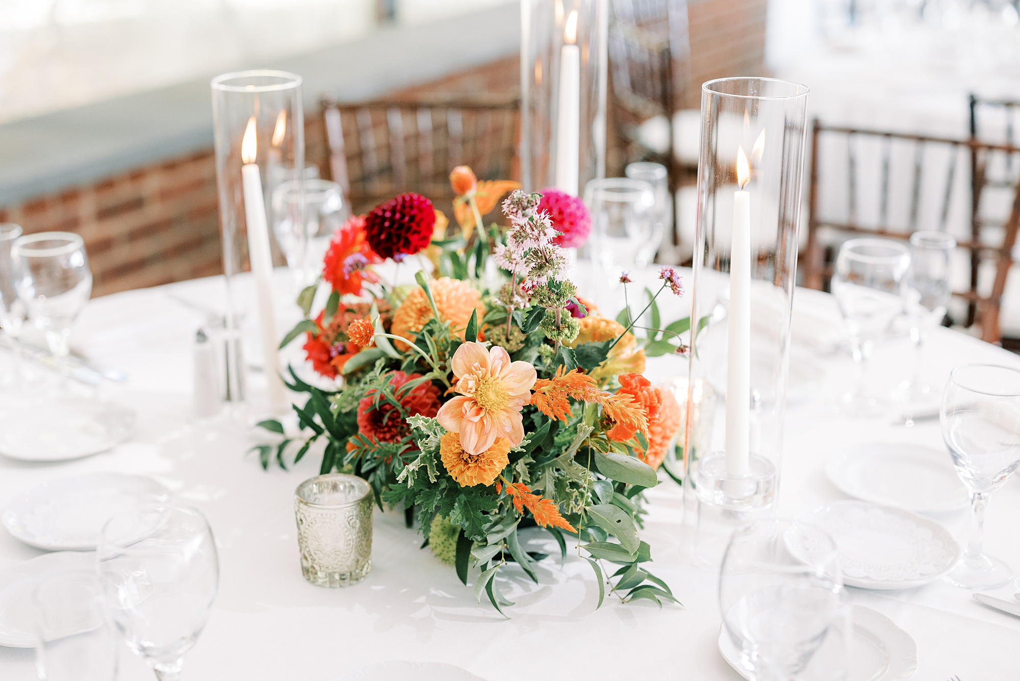 orange and pink flower centerpieces at Greenville Country Club