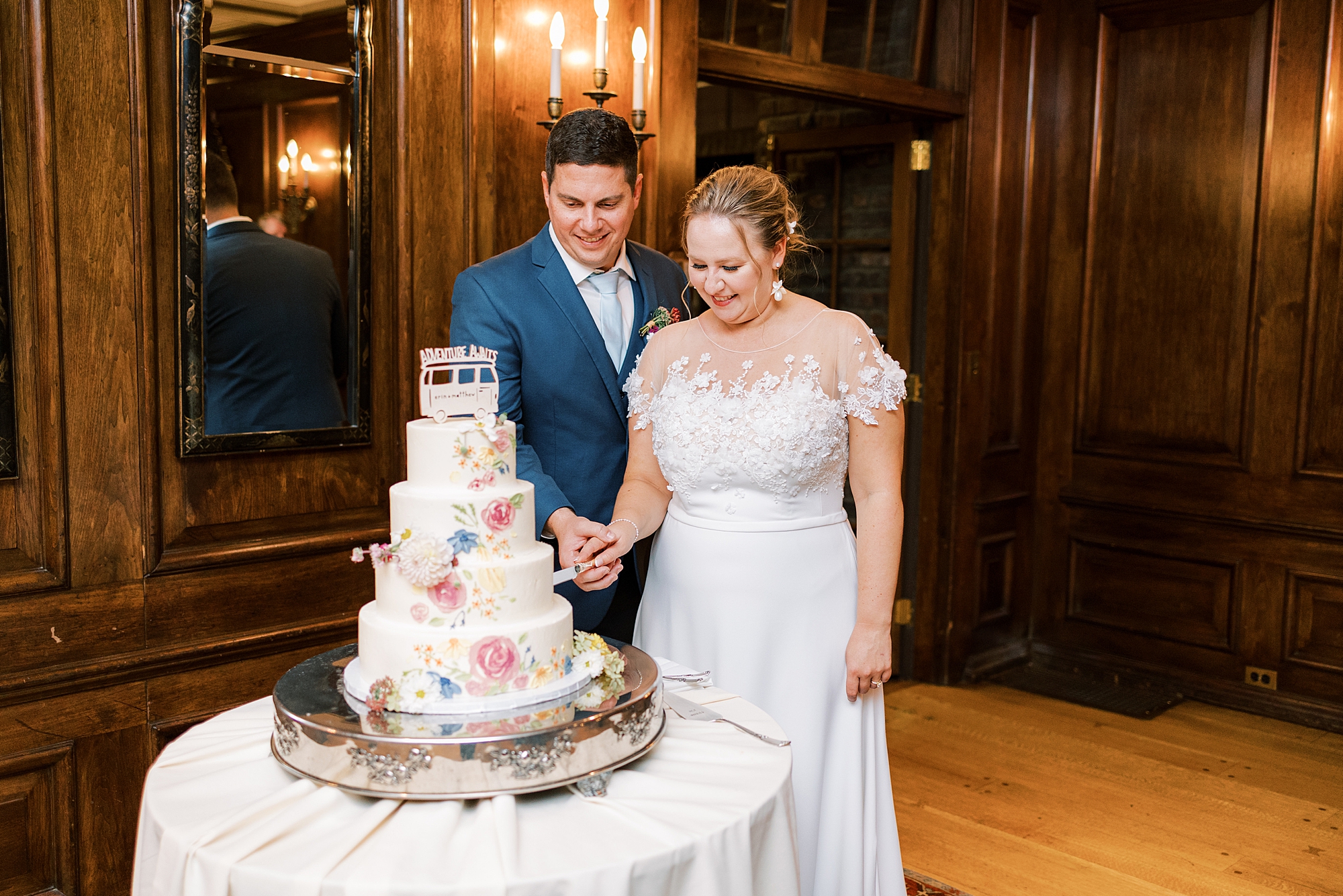 newlyweds cut wedding cake at Greenville Country Club
