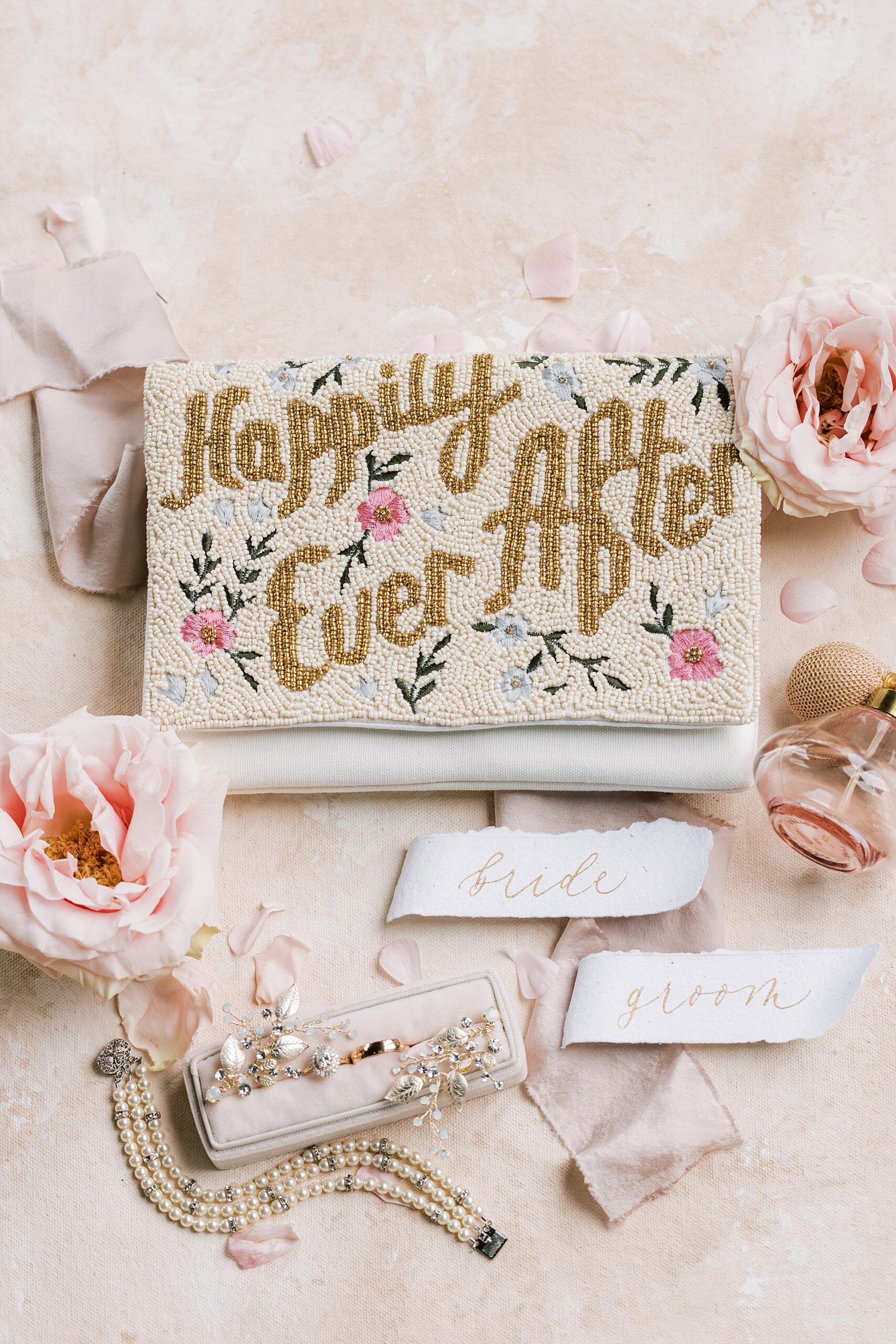 bride's clutch with custom embroidery of "happily ever after"