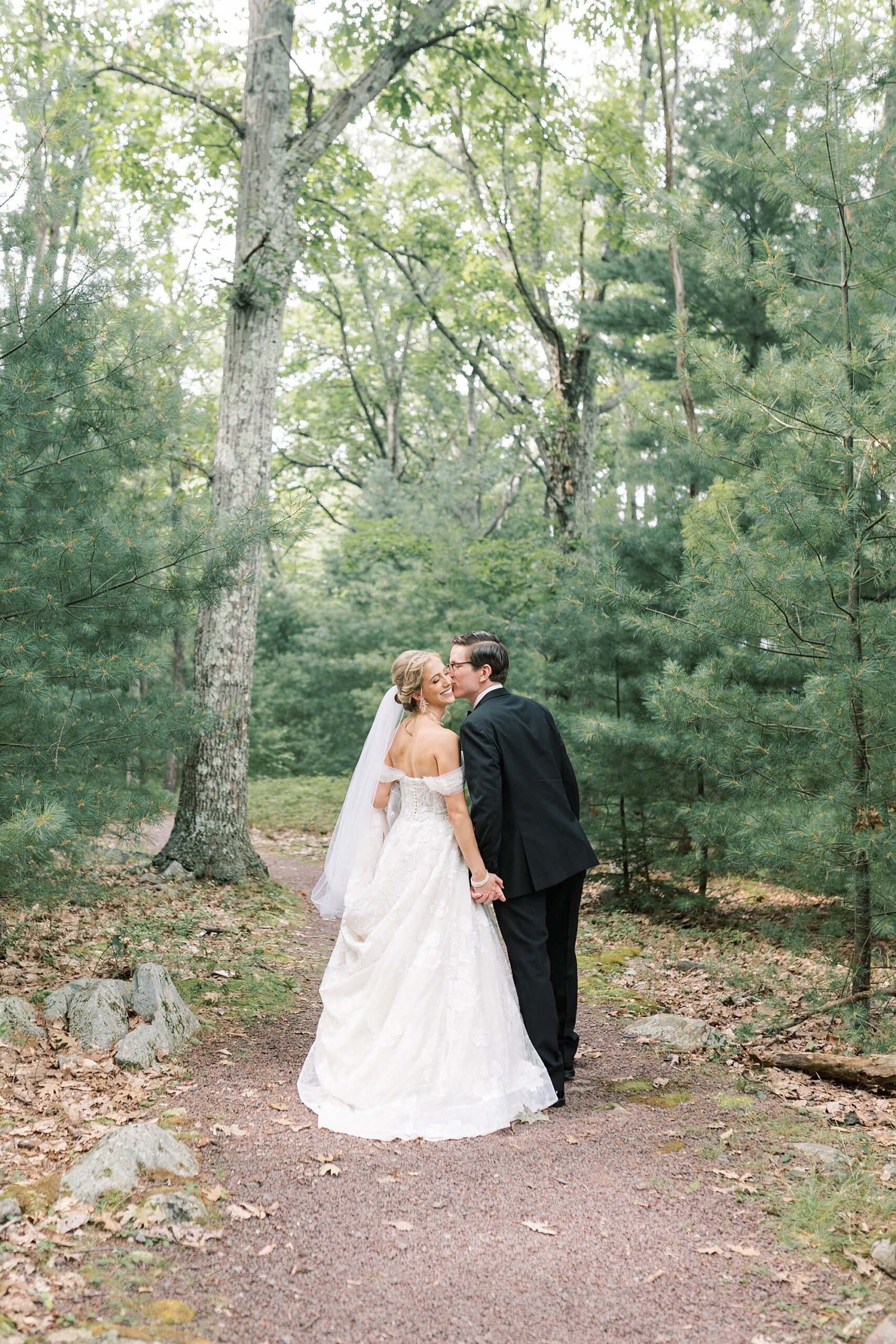 bride and groom kiss on pathway at Skytop Lodge