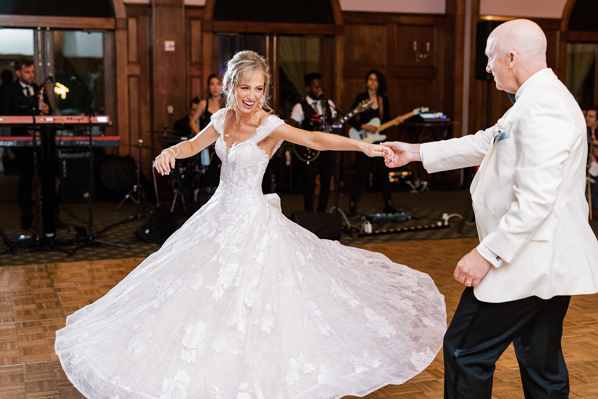 dad twirls bride out during dance at Skytop PA wedding reception
