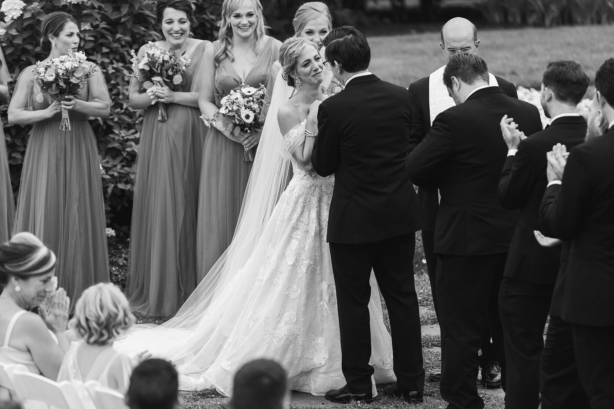 bride and groom laugh during wedding ceremony on lawn at Skytop Lodge