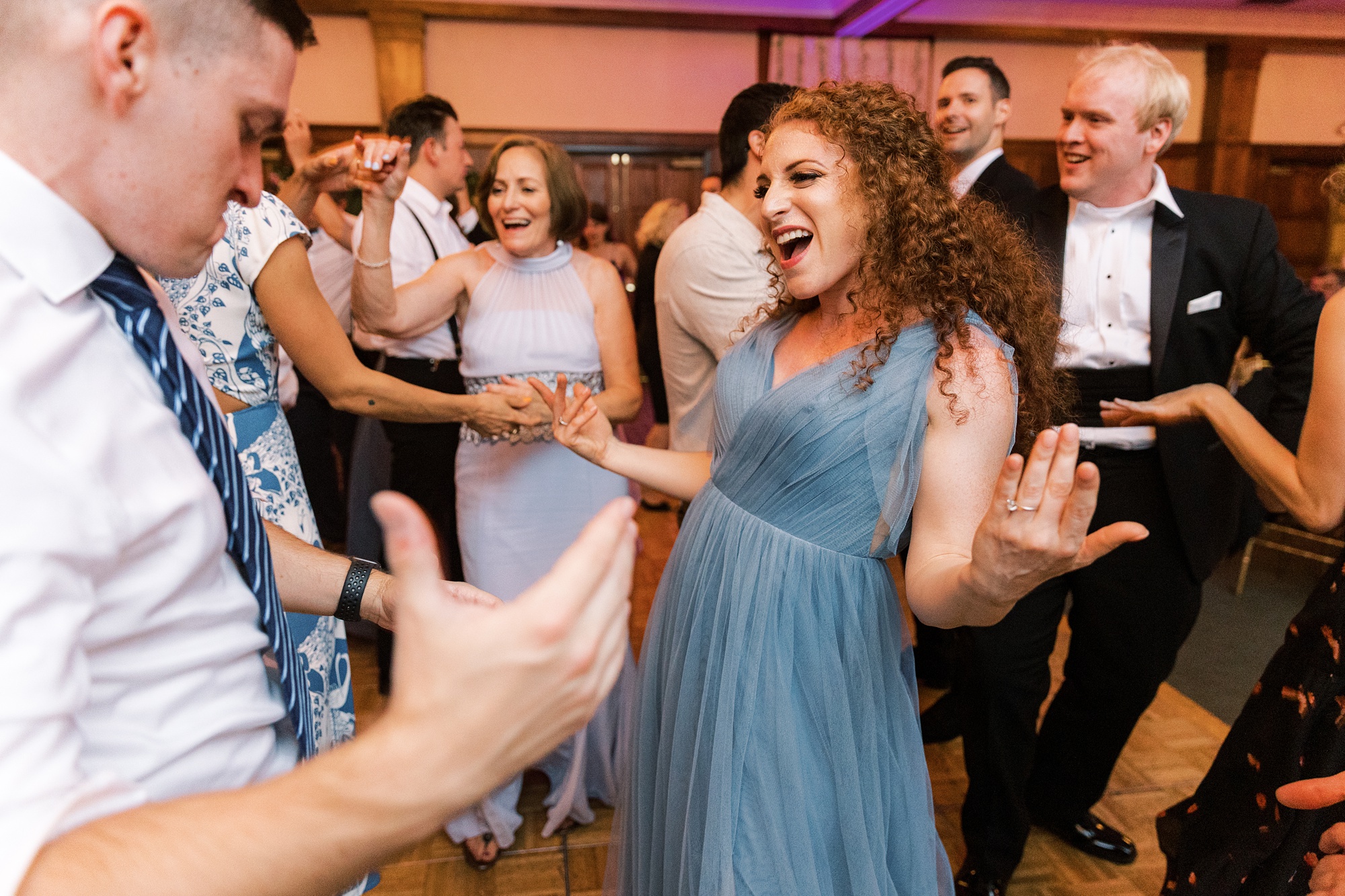wedding guests dance during wedding reception at Skytop Lodge with live band