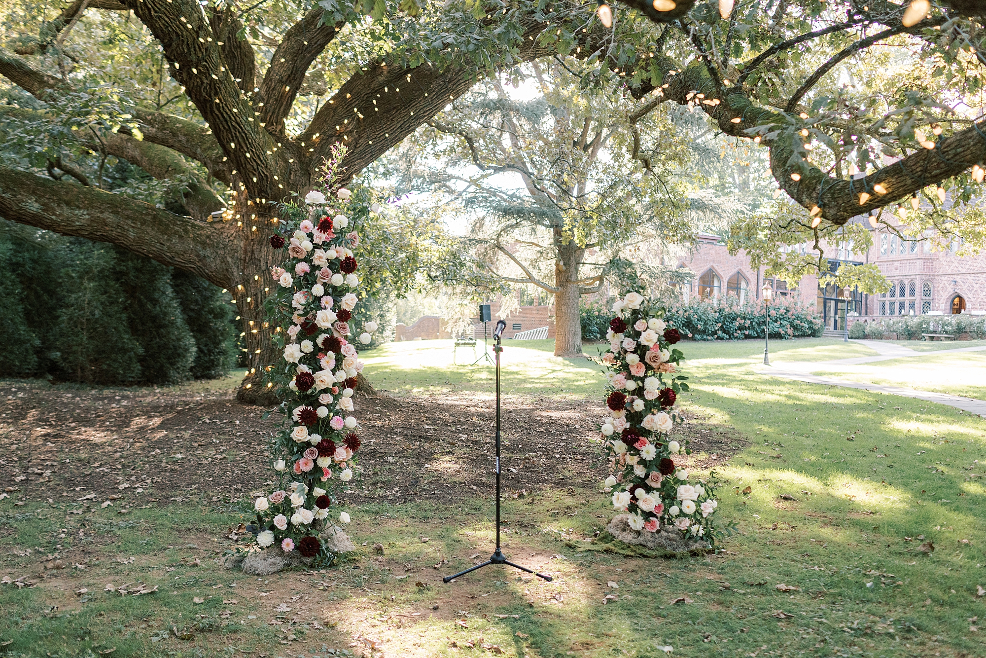 ceremony site at Aldie Mansion with pink, white, and red floral installations