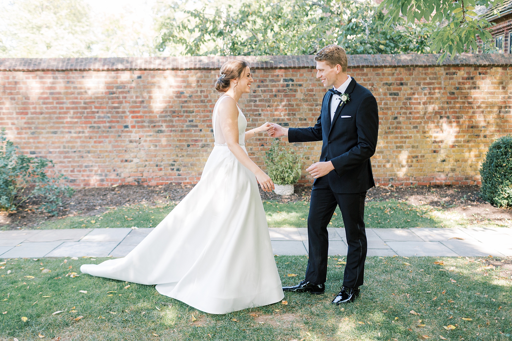 bride and groom meet for first look in courtyard at Aldie Mansion