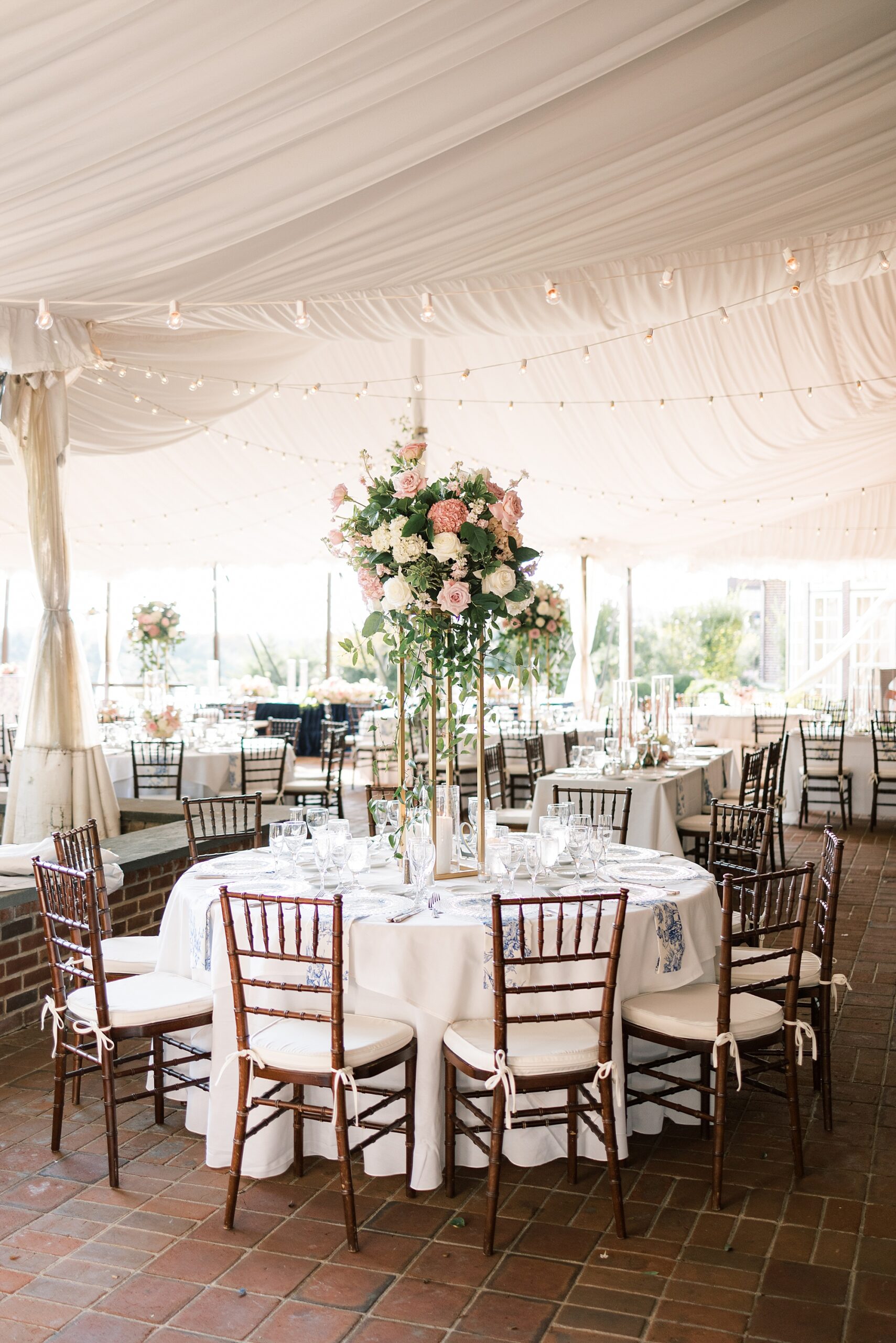 wedding reception under white tent at Greenville Country Club